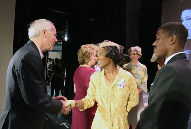 Arkansas Governor Asa Hutchinson is greeted by 
"Little Rock" cast members Anita Welsh and Damian Jermaine Thompson.