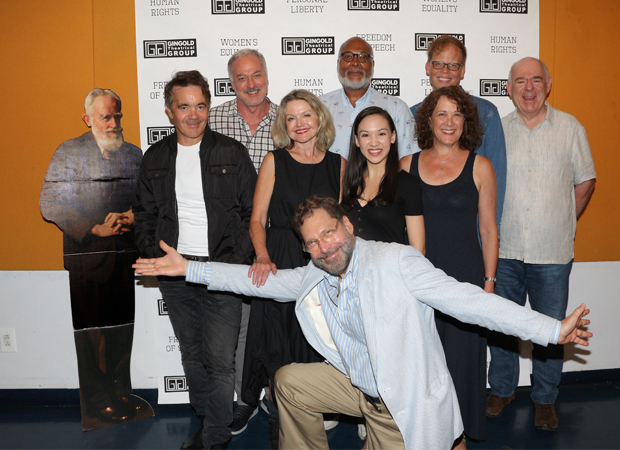 Director/adaptor David Staller (kneeling) and cutout of playwright George Bernard Shaw (left) join the cast of Heartbreak House for a photo.