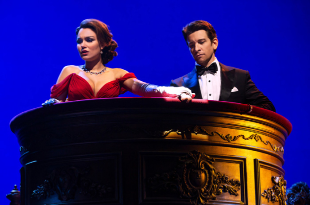 Edward and Vivian, dressed in her iconic red gown, attend La Traviata in a scene from the new musical. 