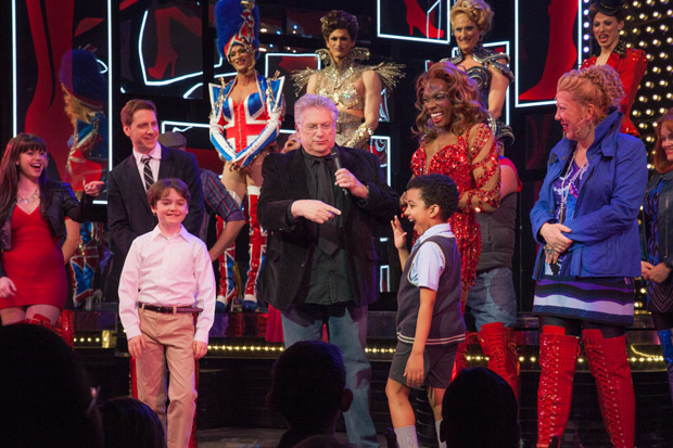 Kinky Boots writer Harvey Fierstein points to one of the show&#39;s two young performers during a curtain call speech celebrating the show&#39;s third anniversary.