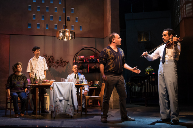 Kristen Sieh, John Cariani, Alok Tewari, Andrew Polk, and George Abud in a scene from The Band&#39;s Visit on Broadway.