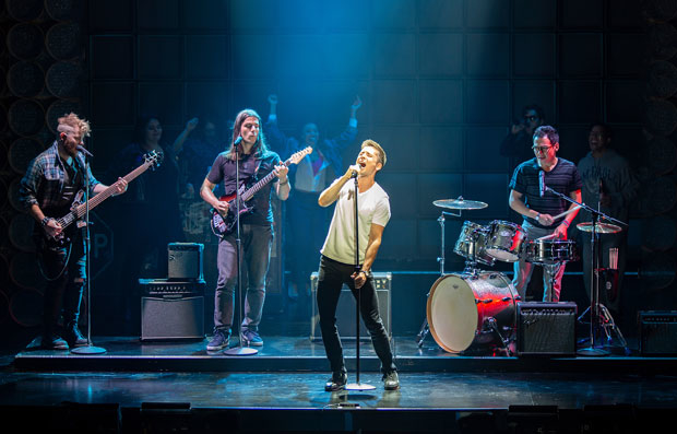 Matt Doyle (center) rocks with F. Michael Haynie, Lucas Papaelias, and Zachary Noah Piser in The Heart of Rock &amp; Roll at The Old Globe Theatre.