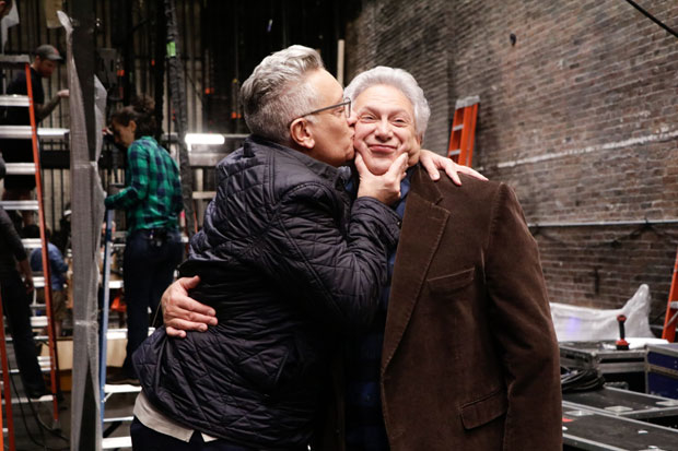 Director Moisés Kaufman plants a kiss on playwright Harvey Fierstein.