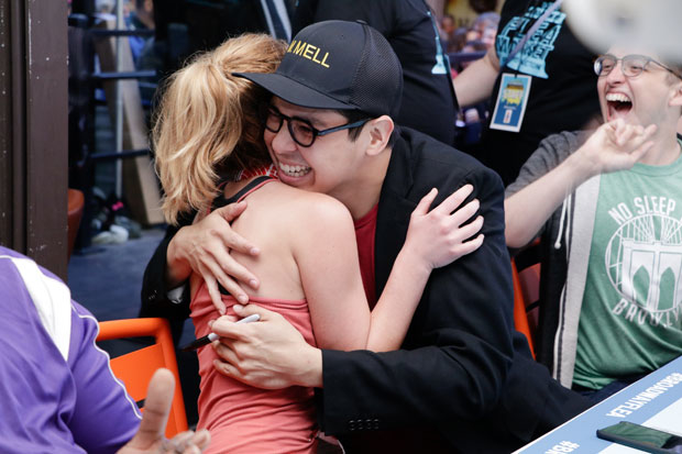 Anastasia&#39;s Christy Altomare gives Be More Chill star George Salazar a hug at a Broadway Flea Market autograph table.