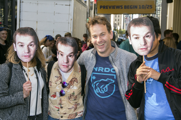 Mike Birbiglia with fans wearing masks of his face.