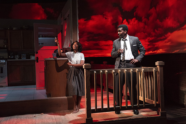 Olivia (Dewanda Wise) and Charles (Khris Davis) stand on the porch in Fireflies.