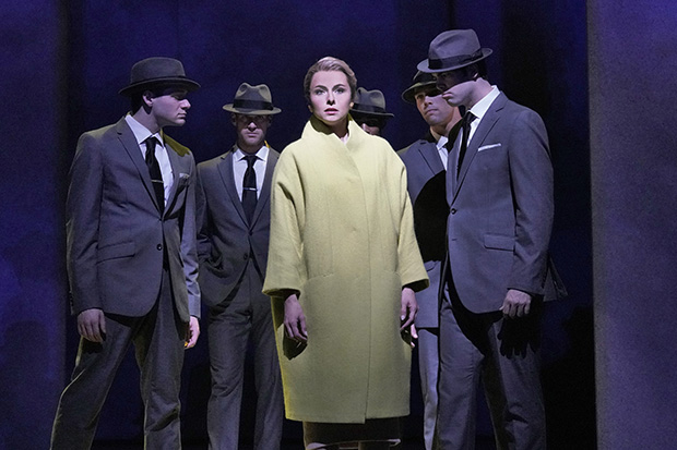 Marine (Isabel Leonard) is surrounded by men in fedoras.