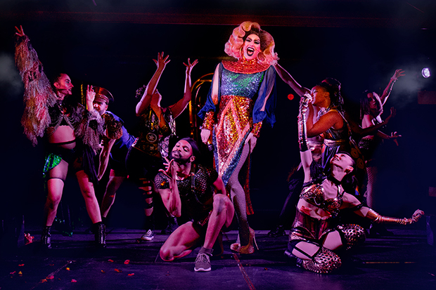 Dusty Ray Bottoms (center) performs with the cast of Cleopatra.