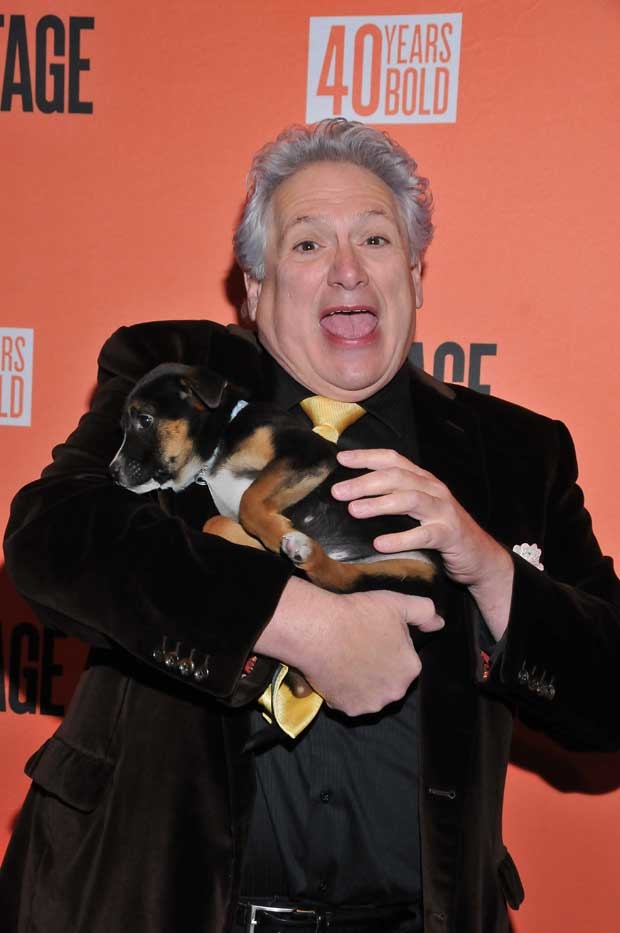 Honoree Harvey Fierstein and a puppy walk the red carpet.