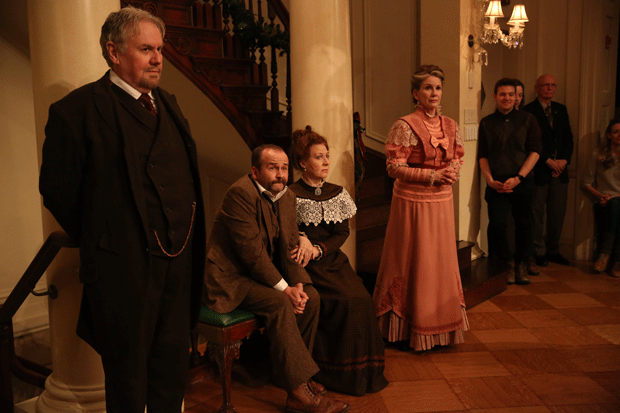 Peter Cormican as Mr. Browne, Ciarán Byrne as Freddy Malins, Terry Donnelly as Mrs. Malins, and Melissa Gilbert as Gretta Conroy in Irish Repertory Theatre&#39;s immersive production of The Dead, 1904.