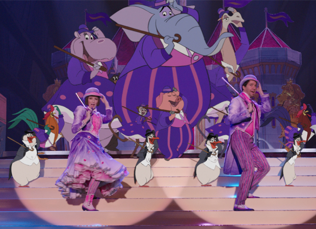 Emily Blunt and Lin-Manuel Miranda dance with penguins in Mary Poppins Returns.
