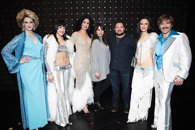 The company of The Cher Show take a photo with Chaz Bono (third from right).