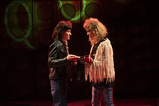 Amy Staats plays Eddie Van Halen, and Megan Hill plays David Lee Roth in Staats&#39;s Eddie and Dave, directed by Margot Bordelon, at Atlantic Stage 2.