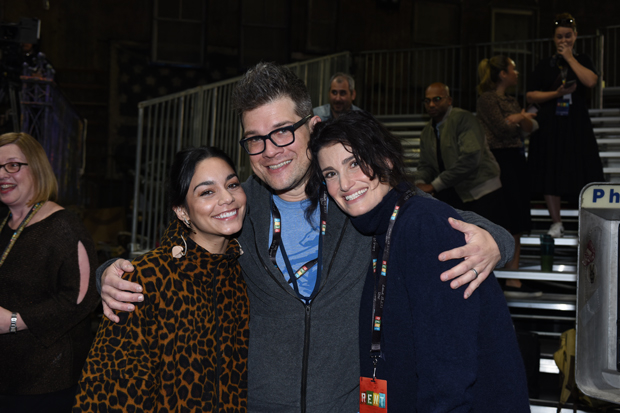 A collision course of two Maureens: Vanessa Hudgens (left) and Idina Menzel (right) with music director Stephen Oremus (center).