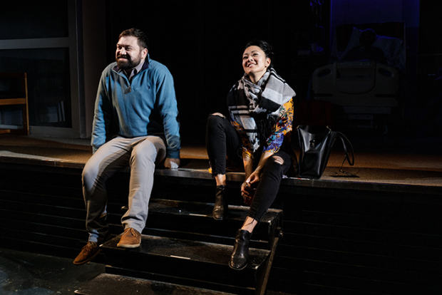 Tom Coiner (John) and Satomi Blair (Hiro) in Primary Stages&#39; New York premiere of God Said This, running through February 15 at the Cherry Lane Theatre.