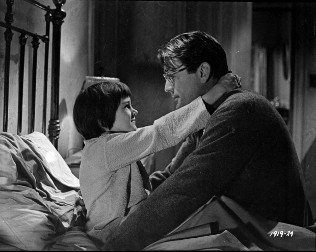 Mary Badham and Gregory Peck as Scout and Atticus Finch in the 1962 film adaptation of To Kill a Mockingbird.