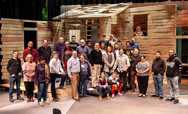 The cast and crew of the Dayton Playhouse production of To Kill a Mockingbird pose on the set.