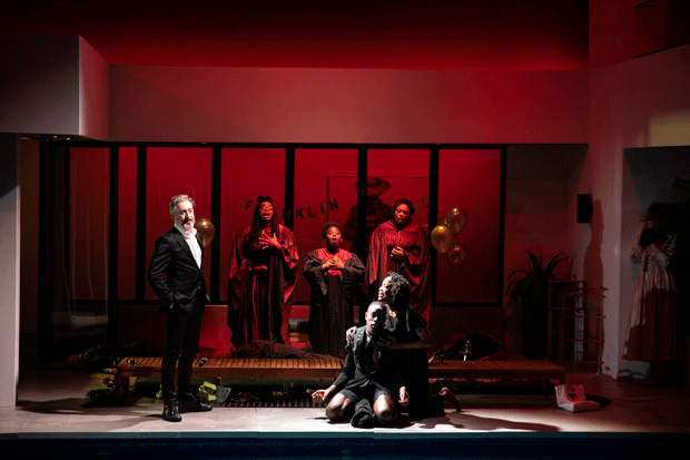 Alan Cumming as Andre, Ronald Peet as Franklin, Charlayne Woodard as Zora, and Onyie Nwachukwu, Denise Manning, Carrie Compere as the Gospel Choir in the New Group and Vineyard Theatre production of Jeremy O. Harris&#39;s &quot;Daddy&quot;, directed by Danya Taymor, at the Pershing Square Signature Center.