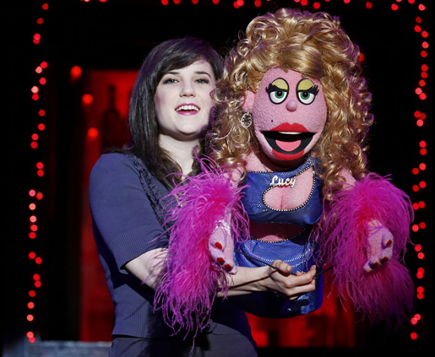 Veronica Kuehn with Lucy the Slut in a scene from Avenue Q, now running through May 26 at New World Stages.