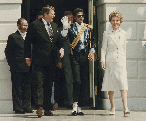 Michael Jackson (center) appears with President Ronald Reagan and First Lady Nancy Reagan.