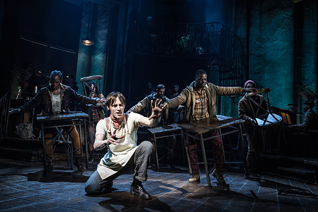 Reeve Carney (center) plays Orpheus in the Broadway run of Hadestown.