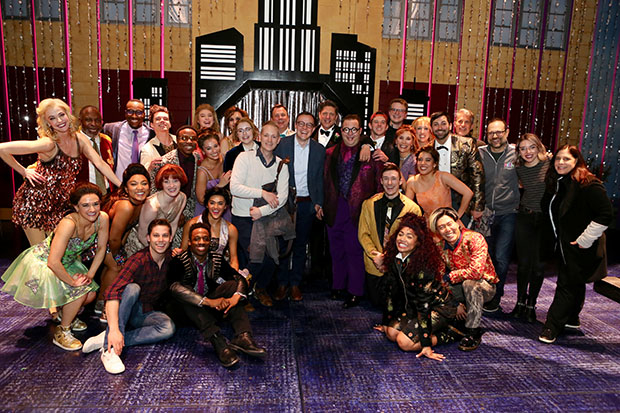 Chasten Buttigieg (center) poses for a photo with the cast and crew of The Prom on Broadway.