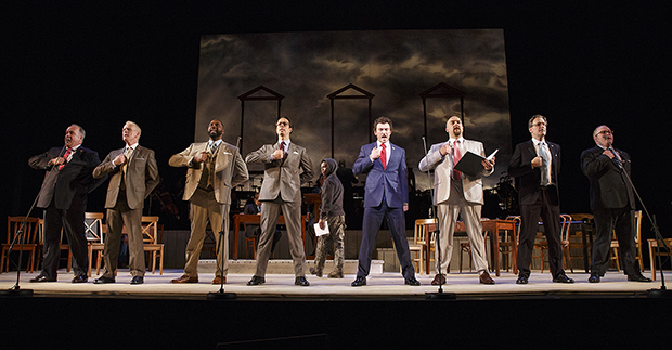 Kevin Ligon, John Hickock, Nicholas Ward, Laird Mackintosh, Bryce Pinkham, Alexander Gemignani, John Hillner, and Jacob Keith Watson sing &quot;Cool, Cool, Considerate Men&quot; as John-Michael Lyles (background) looks on in the Encores! production of 1776.