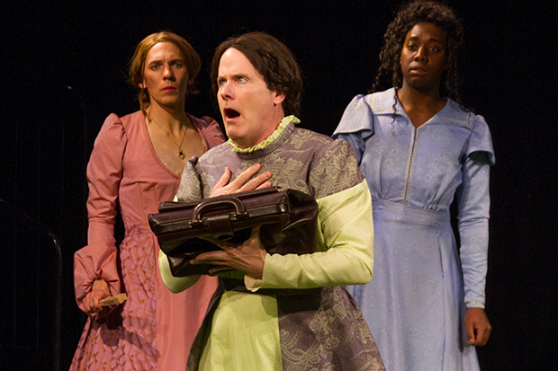 Clay Storseth (Miss Prism) is flanked by Jed Peterson (Gwendolen) and Ademide Akintilo (Cecily) in New York Classical Theatre&#39;s reversed gender production of The Importance of Being Earnest.