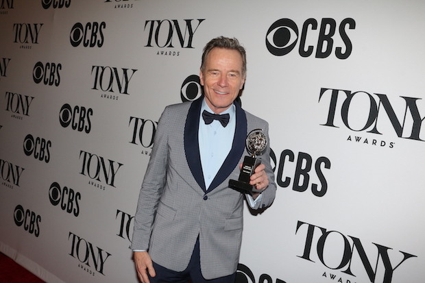 Bryan Cranston smiles with his Tony Award in the press room.