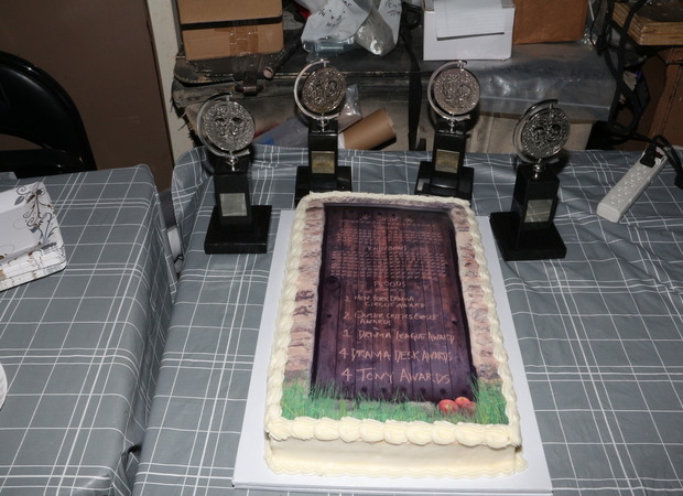 A cake and a collection of Tonys.