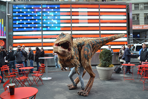 A baby Tyrannosaurus rex appears in Times Square to promote Walking With Dinosaurs — The Arena Spectacular.