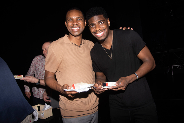 Shawn Bowers and Jawan M. Jackson take pieces of the cake celebrating Ain&#39;t Too Proud&#39;s 100th Broadway performance.