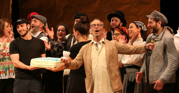 Joel Grey and the company of Fiddler on the Roof in Yiddish celebrate their year anniversary.