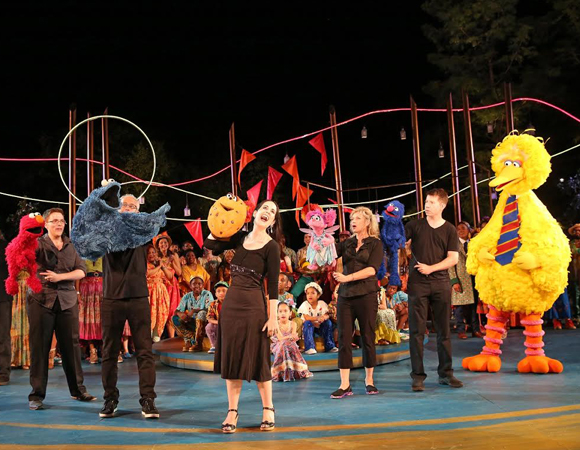 Elmo, Cookie Monster, Cookie, Abby Cadabby, Grover, and Big Bird (with their respective puppeteers) in the 2014 Public Works production of The Winter&#39;s Tale.
