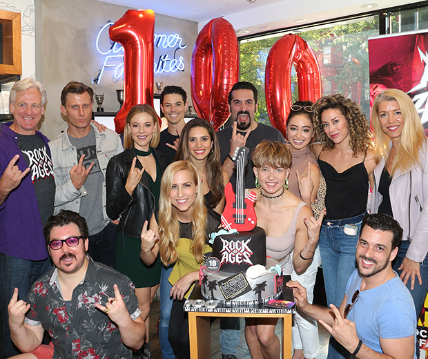 The cast of Rock of Ages and their cake.