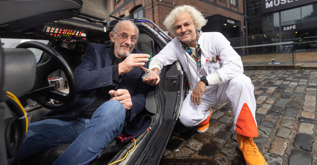 Christopher Lloyd hands the keys to the DeLorean to Roger Bart.