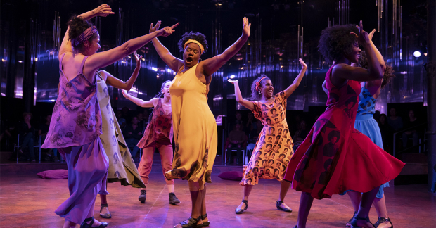 Adrienne C. Moore (center) and the company.