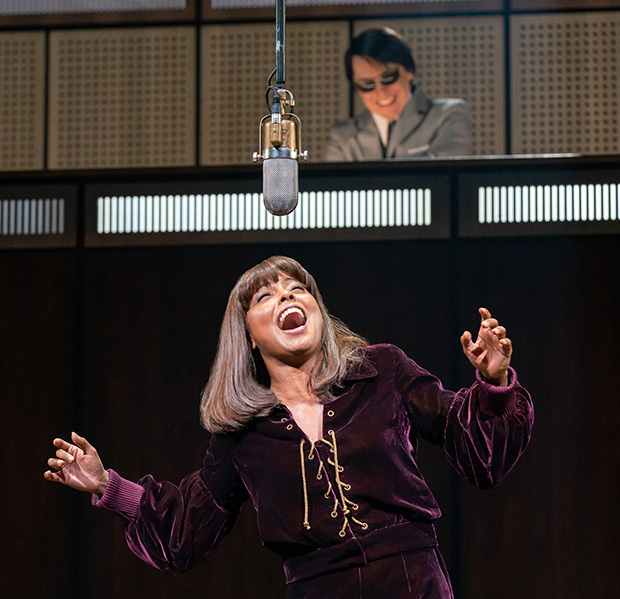 Adrienne Warren (lower) plays Tina Turner, and Steven Booth (upper) plays Phil Spector in Tina: The Tina Turner Musical.