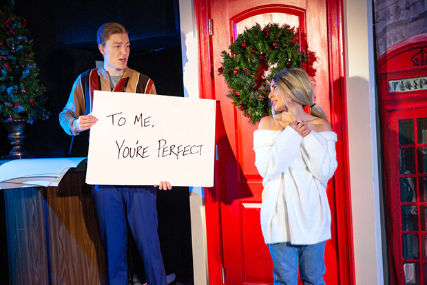 Eric Peters plays Walking Dead Guy, and Kayla Catan plays Keira in Bob and Tobly McSmith&#39;s Love Actually? The Unauthorized Musical Parody, directed by Tim Drucker, at the Jerry Orbach Theater.