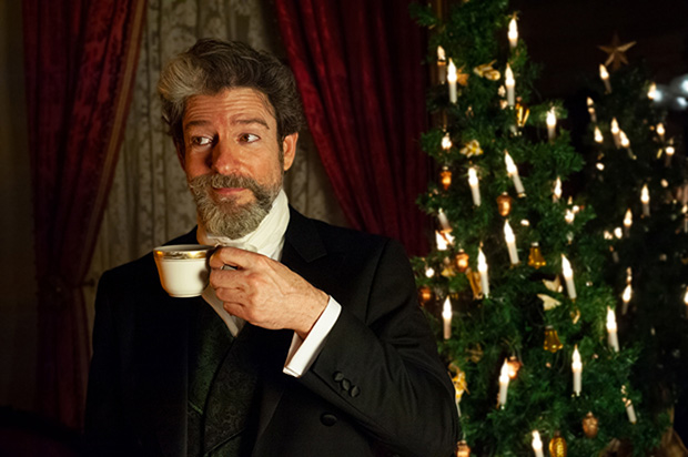 John Kevin Jones delivers a cup of holiday cheer in A Christmas Carol at the Merchant&#39;s House.