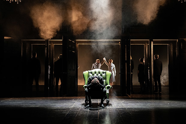 Claudius (Owen Roe) and Gertrude (Fiona Bell) announce their marriage at the upstage balcony as Hamlet (Ruth Negga) despairs downstage in Hamlet.