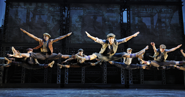 The ensemble of Newsies on Broadway.