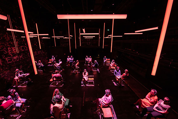 Audiences sit on the theater floor in isolated pods in Blindness.