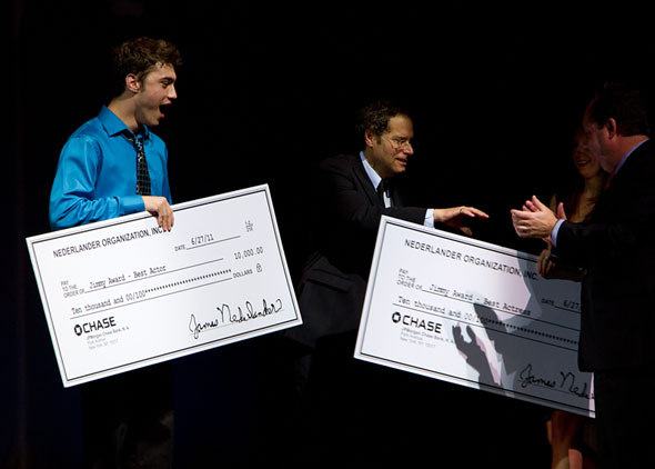 Best Actor winner Ryan McCartan accepting his award check from Van Kaplan at the 2011 Jimmy Awards ceremony.