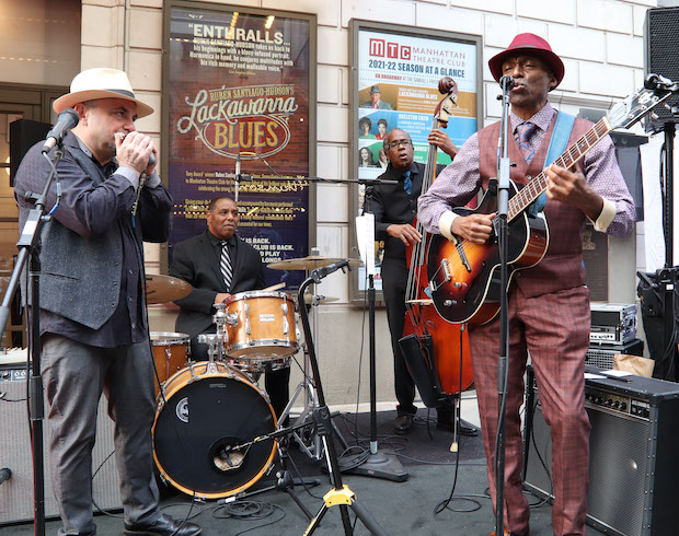 Nanny's Band (Ayode Maakheru on vocals/guitar, Booker King on bass, Barry Harrison on drums, Matthew Skoller on harmonica) performs outside the Samuel J. Friedman Theatre for the first preview of Lackawanna Blues. 