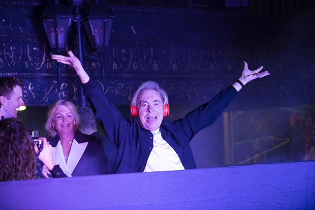 Andrew Lloyd Webber in a DJ booth set up on 44th Street after the performance