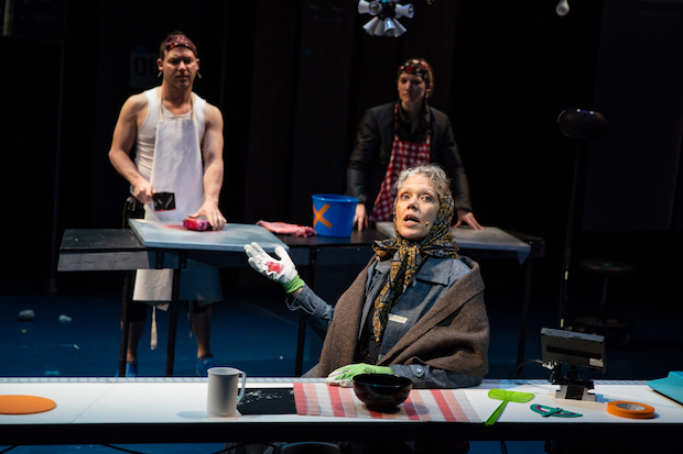 Kate Valk (front), Ari Fliakos, and Erin Mullin (back) star in Bertolt Brecht&#39;s The Mother, directed by Elizabeth LeCompte for the Wooster Group at the Performing Garage.