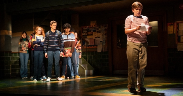 Holden William Hagelberger (right) plays the title role in Trevor, a new musical written by Dan Collins and Julianne Wick Davis and directed by Marc Bruni at Stage 42. Sammy Dell (left, center) leads the company of students.