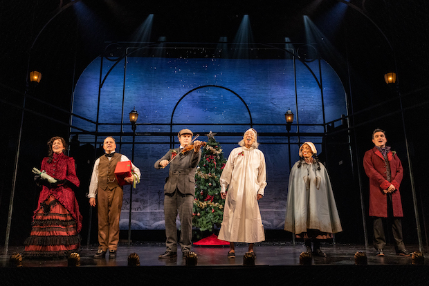 The cast of A Sherlock Carol sings at New World Stages. 
