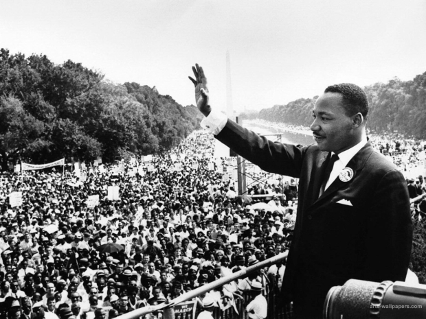 Dr. Martin Luther King Jr. appears before a crowd at the National Mall. 